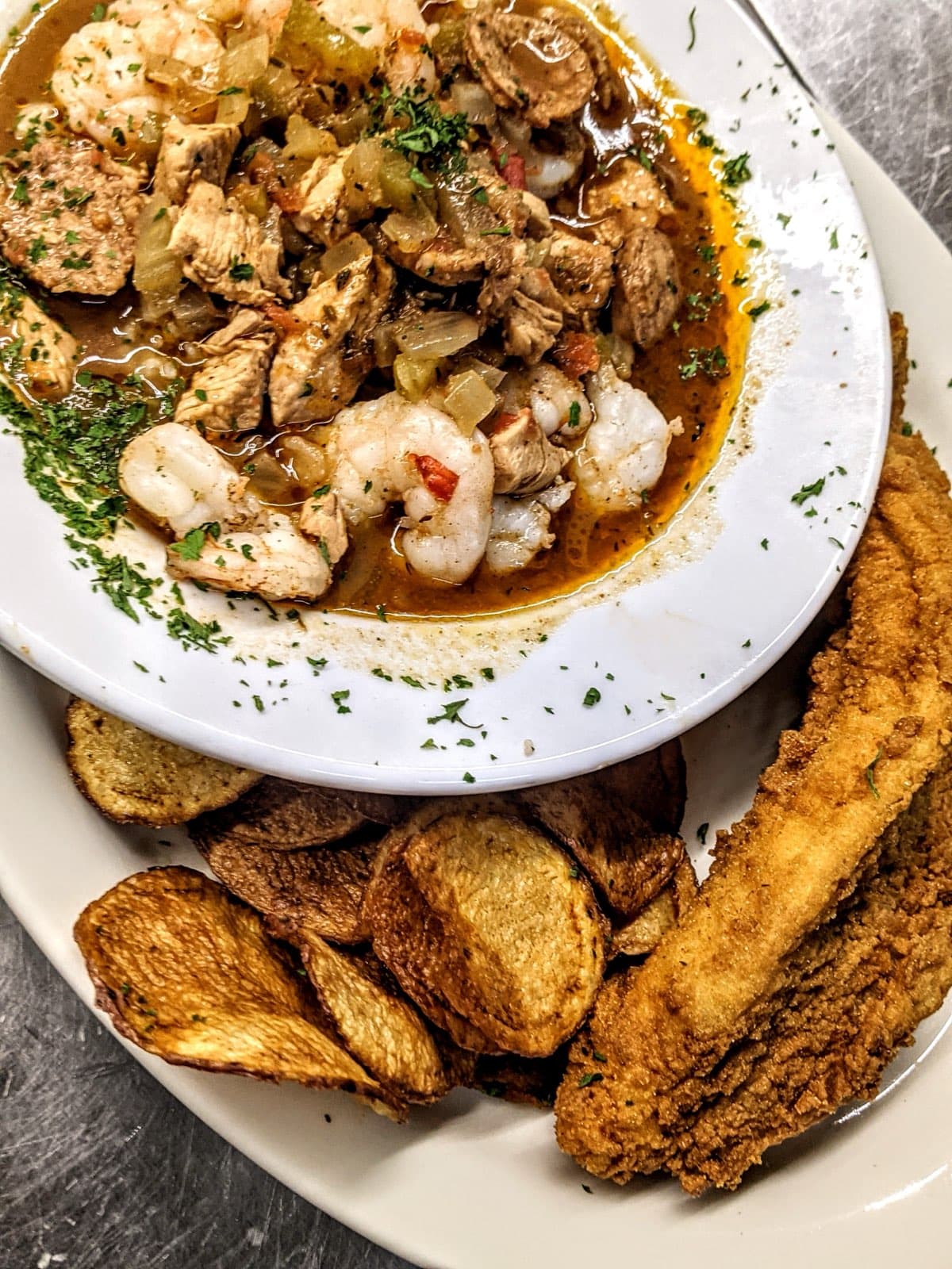 Shrimp and chicken étouffée with fried fish at Rosey Baby